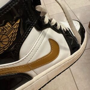 Michael Jordan Nike High-Top Sneakers in Black, White, and Gold